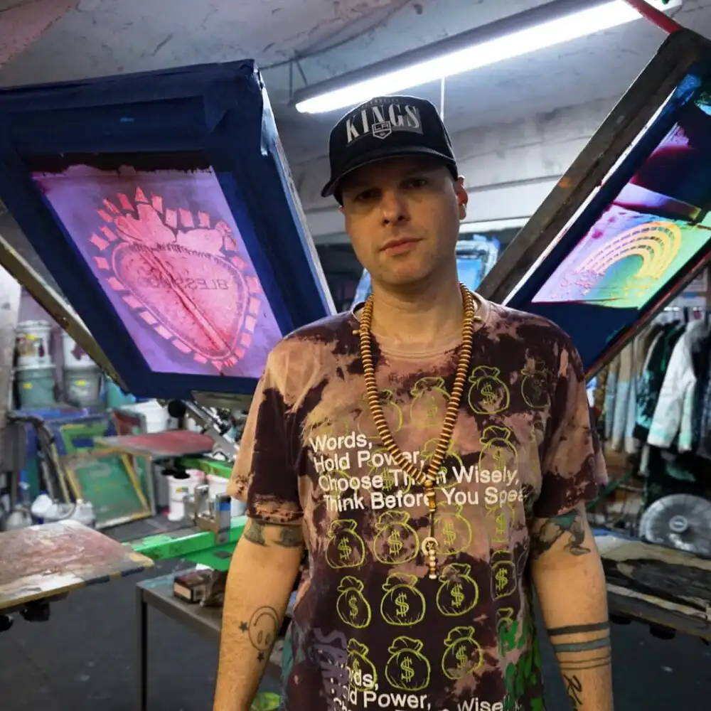 Doobie Duke Sims screen printing T-shirts for Snow Milk, his streetwear brand launched from a Brooklyn basement.