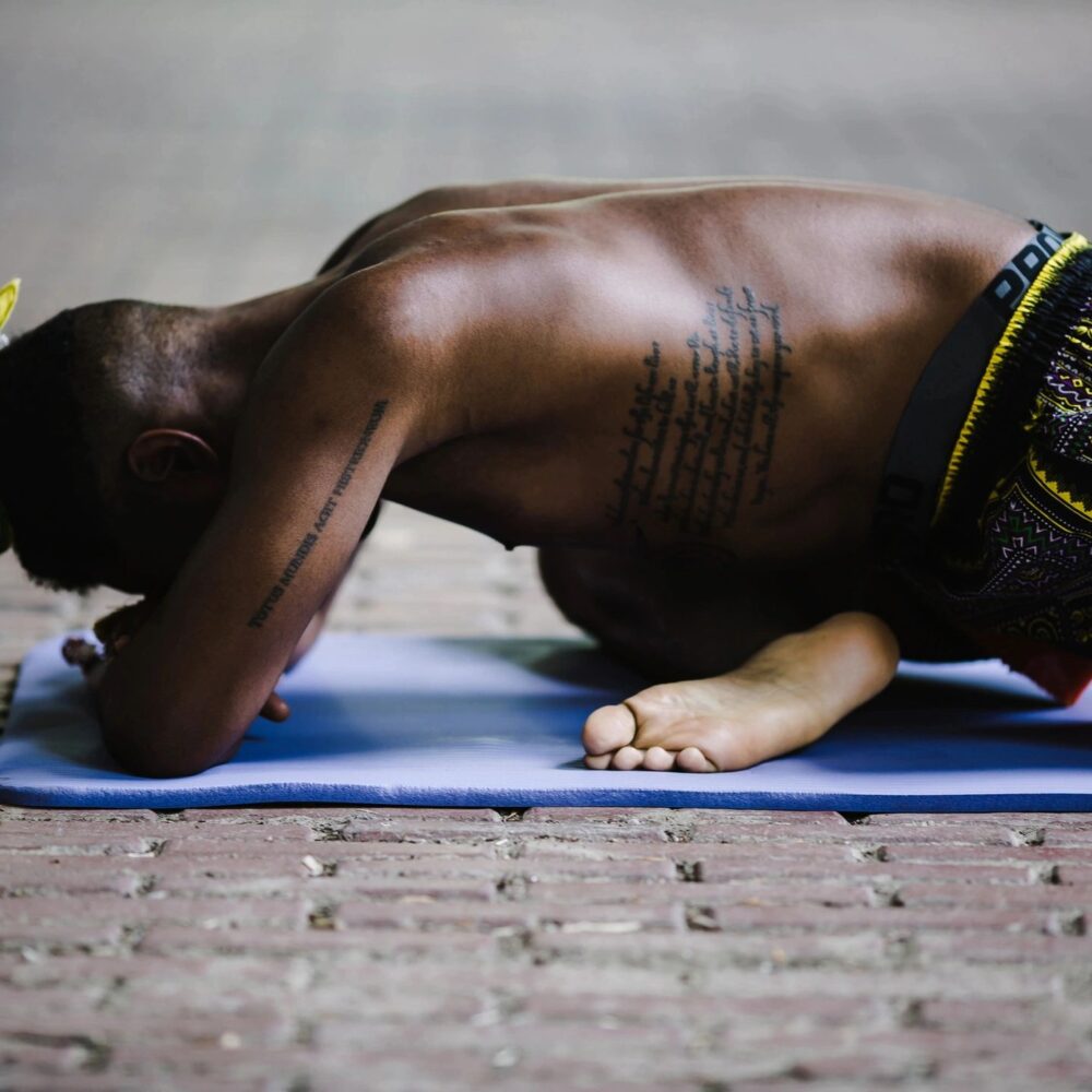 Image showing mad practicing meditation front position stretching with head down stretching legs doing yoga