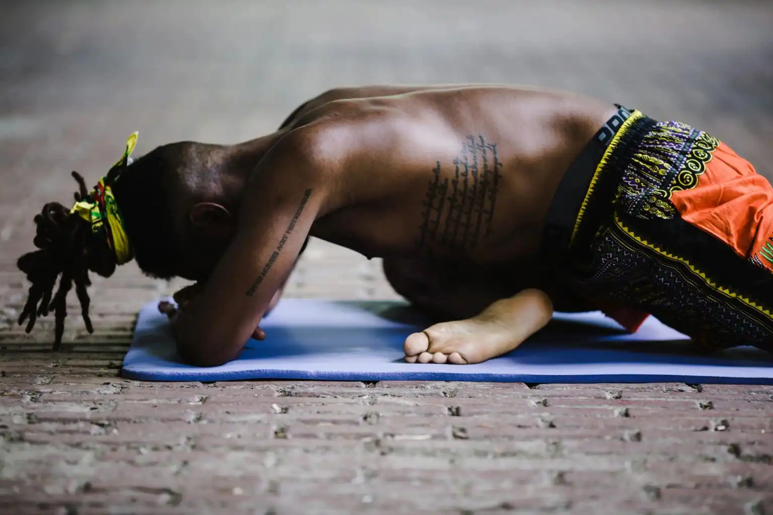 Image showing mad practicing meditation front position stretching with head down stretching legs doing yoga