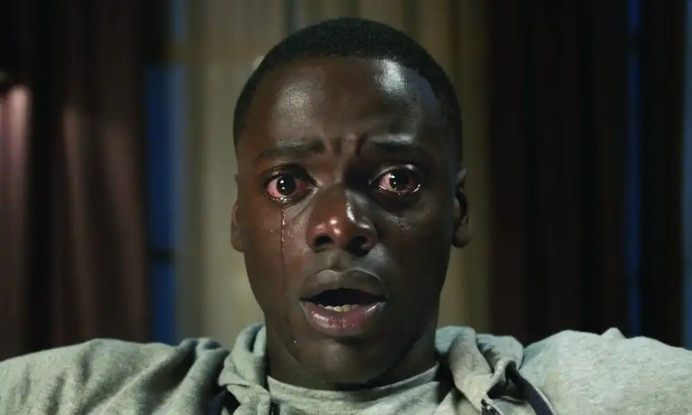 Person experiencing a nightmare, reflecting hidden meanings behind common scary dreams.