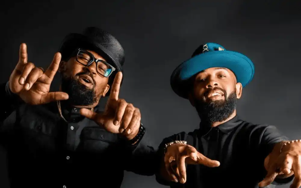 Handcrafted wide-brim hat with feather and gold trim from Fruition Hat Co., a Black designers hat company in Atlanta.