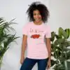 Pretty girl wearing a Love T-Shirt in a casual, stylish outfit. Lots of Love T-Shirt with heart graphic promoting kindness and positivity