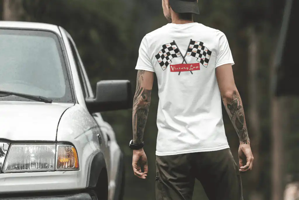 Streetwear graphic t-shirt with bold Victory Lap on back by Mastuhree Brand, styled casually.