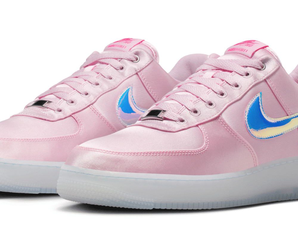 Pink Nike Air Force 1 Breast Cancer Awareness Low with satin upper, iridescent Swoosh, and pink ribbon heel design.