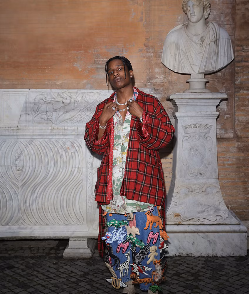 Photo of A$AP Rocky wearing a high-fashion streetwear outfit, showcasing his signature cutting-edge style.