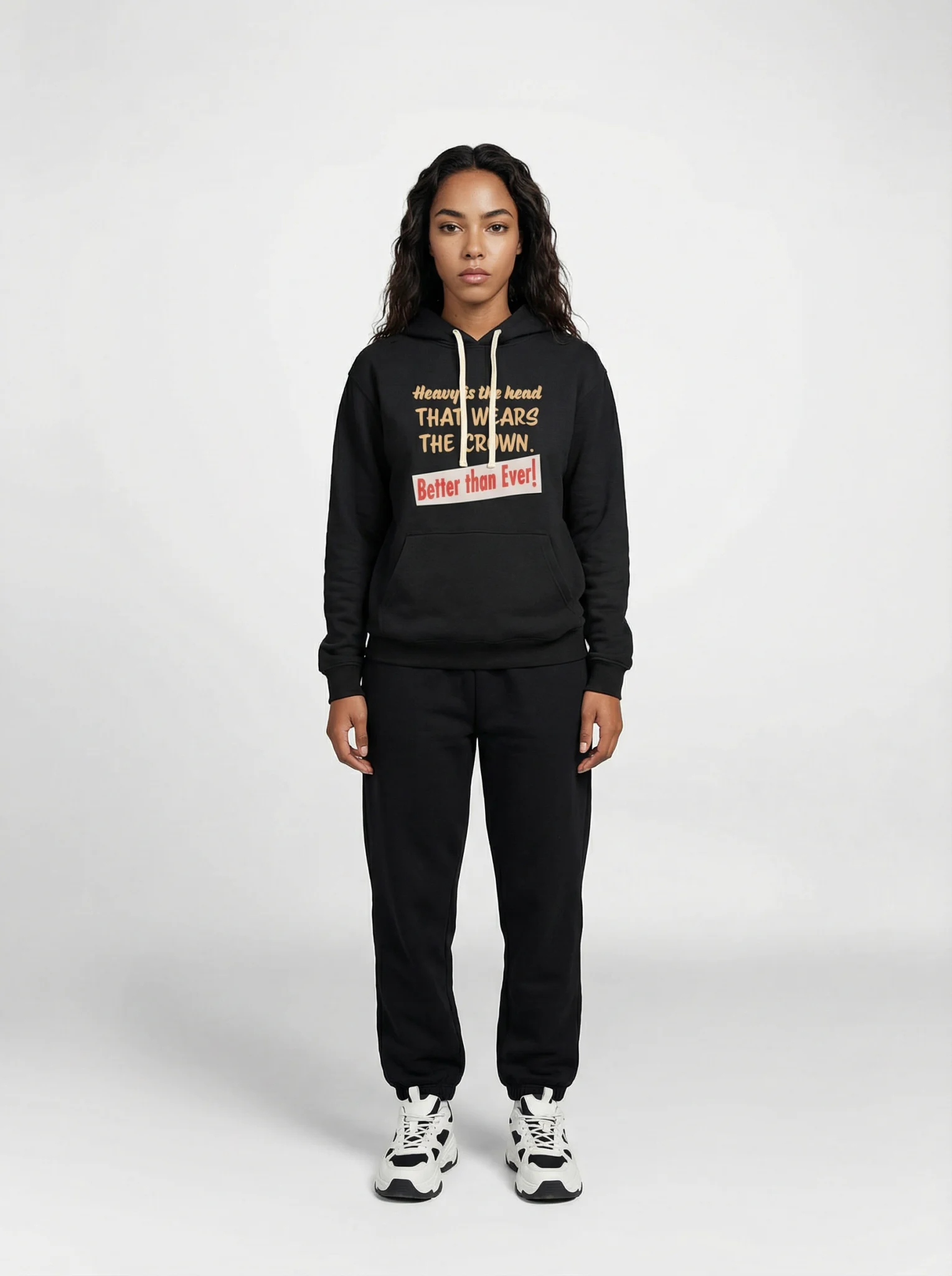 Front view of a female model wearing the Heavy Is the Head hoodie by Mastuhree, showcasing premium heavyweight fabric, minimalist design, and confident streetwear style.