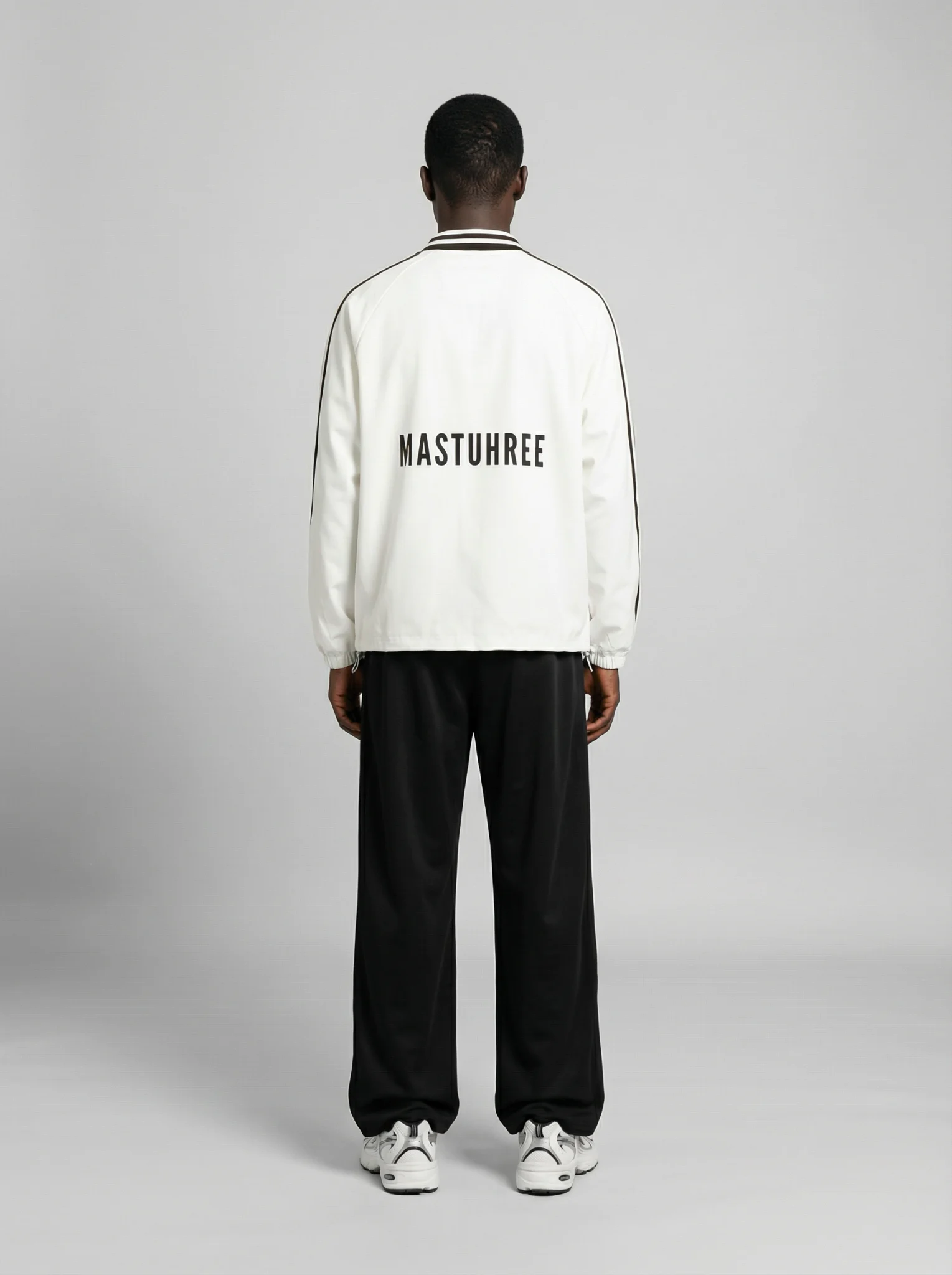 Back view of a young man wearing the Vintage Classic shirt by Mastuhree, featuring a clean silhouette, premium fabric, and timeless streetwear design.