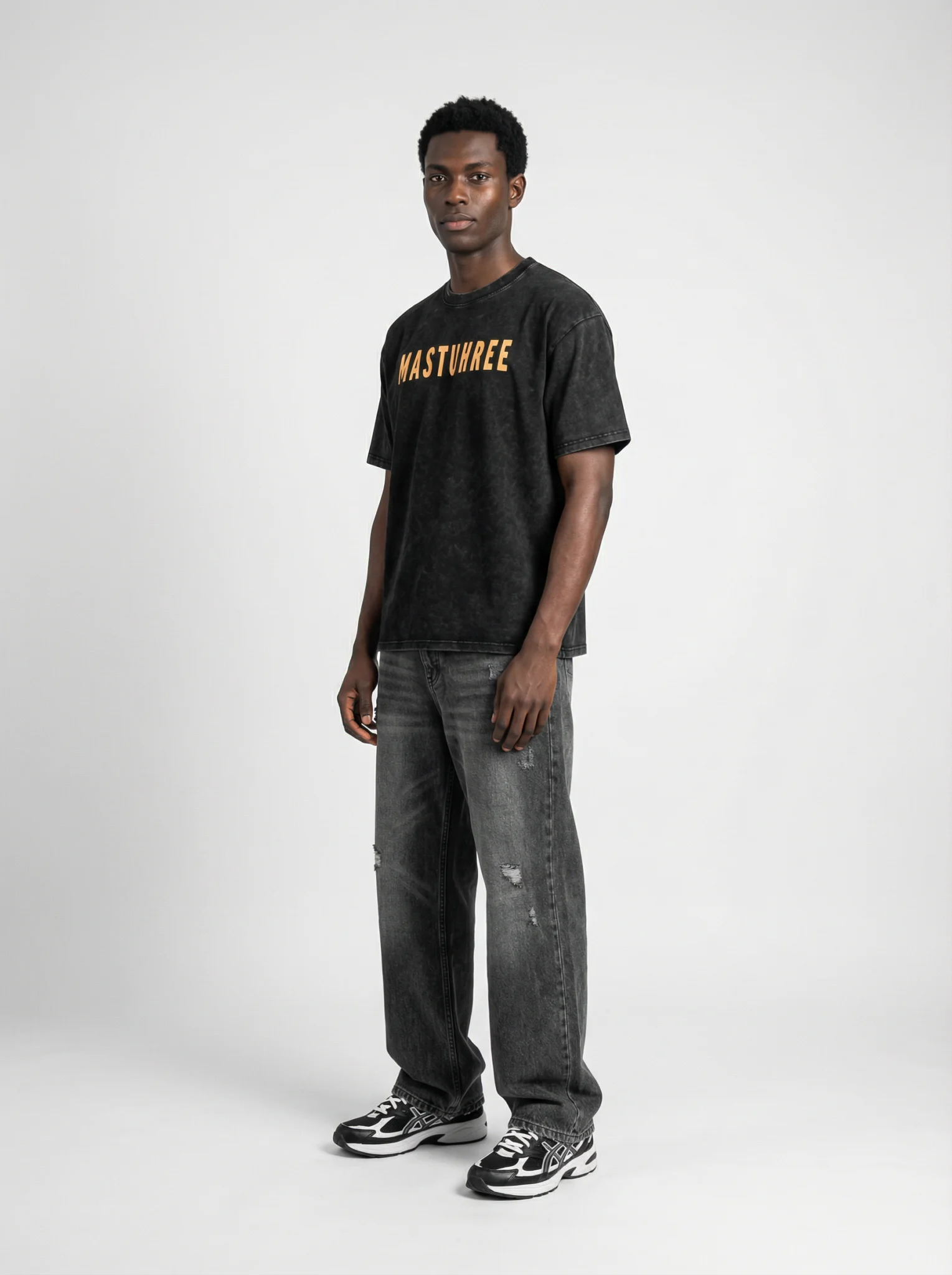 Front view of a young man wearing the White Wash Classic Mastuhree t-shirt, featuring a vintage washed finish, premium cotton fabric, and minimalist streetwear design.