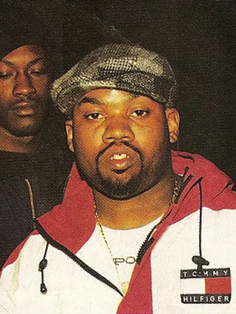 Raekwon wearing vintage Tommy Hilfiger jacket, symbolizing how Wu-Tang transformed preppy fashion into hip hop streetwear.