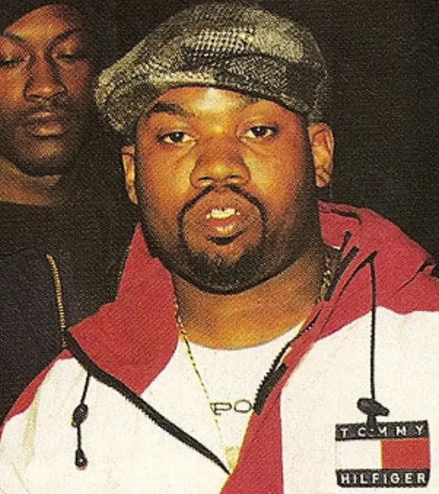 Raekwon wearing vintage Tommy Hilfiger jacket, symbolizing how Wu-Tang transformed preppy fashion into hip hop streetwear.