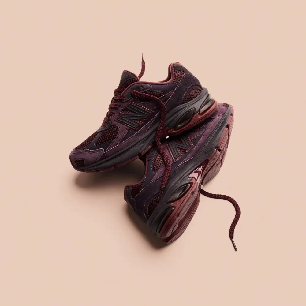 Rich Paul x New Balance Abzorb 2010 Unbothered sneakers stacked in studio lifestyle shot