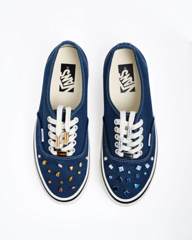 SZA custom Vans Authentic 44 sneakers in navy blue with gemstone embellishments and VANSZA lace tags designed by Rachel Goatley