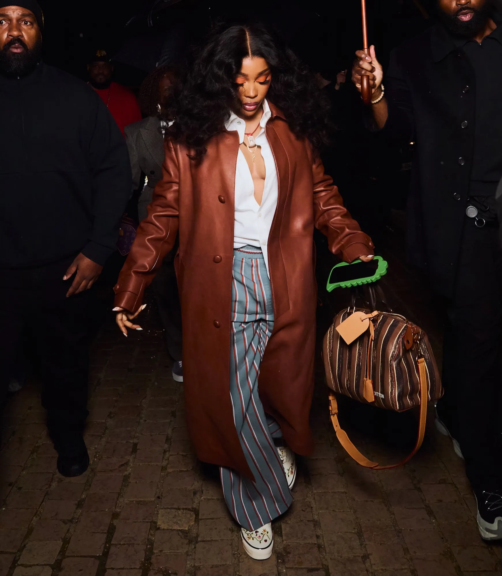 SZA arriving at Louis Vuitton men’s fashion show in Paris wearing custom Vans sneakers