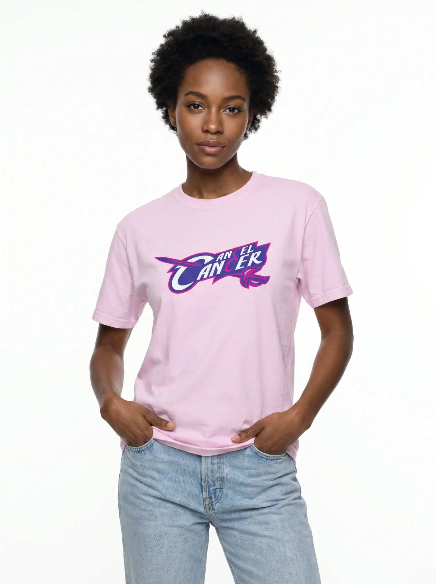 Female model wearing the Mastuhree Brand Cancel Cancer graphic t-shirt in pink with light denim jeans, representing cancer awareness, hope, strength, survivorship, and purpose-driven streetwear fashion. The design supports fighters, survivors, caregivers, and advocates in the fight against cancer.